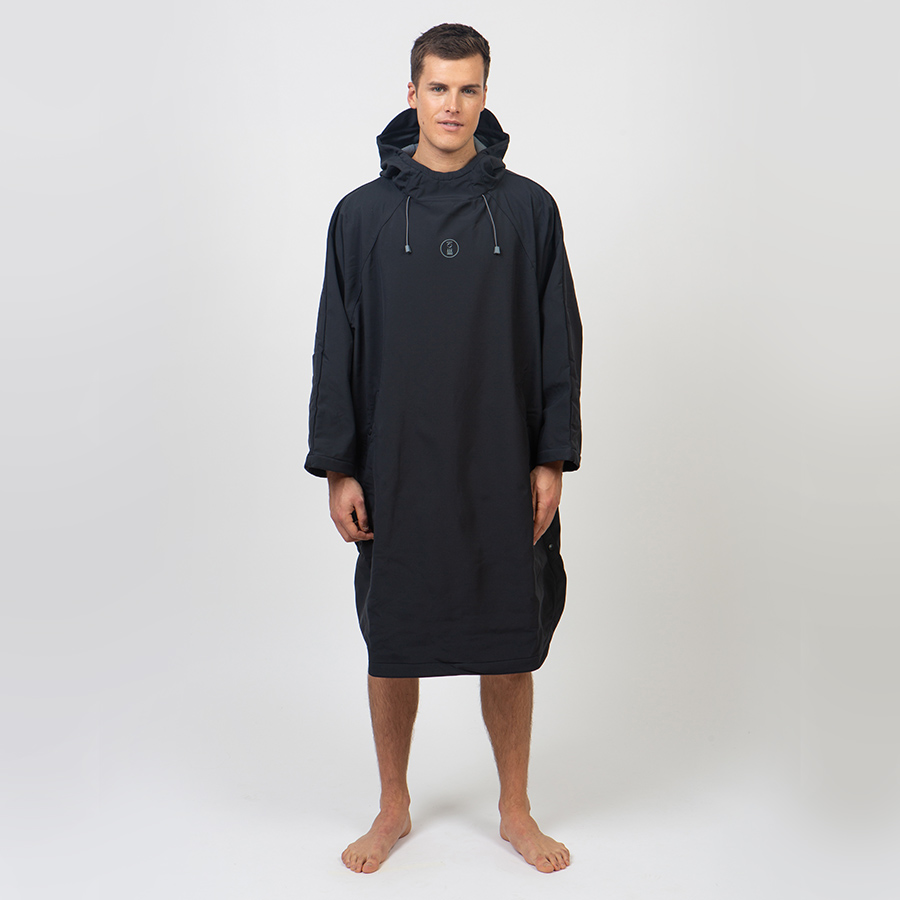 Male wearing black poncho by Fourth Element